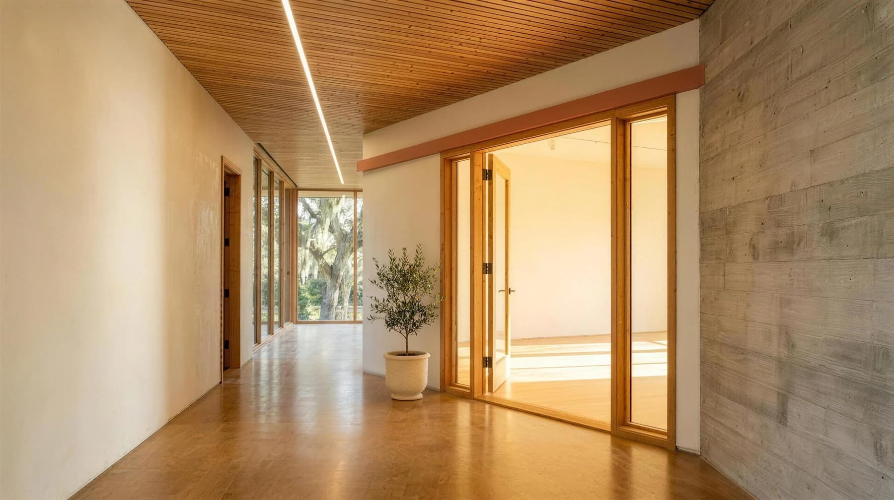 An open doorway with warm light spilling from the room beyond. Concept rendering, Maai\u00AE Savannah studio.